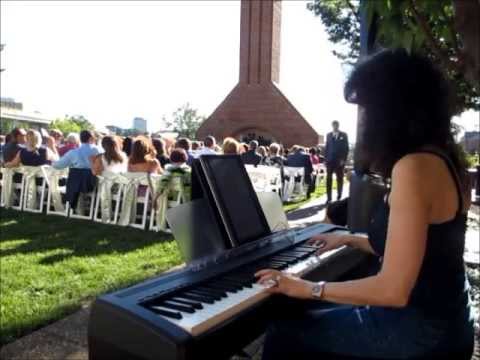 Image Showing A Woman Playing The Grand Digital Piano In A Modern Wedding.