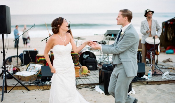 Image of Stunning Dancing Couple During Their Wedding Party While Playing Musical Instruments.